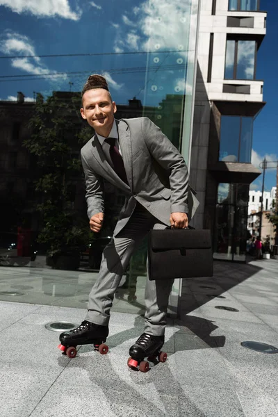 Positive Roller Skater Formal Wear Holding Black Briefcase Looking Camera — Stock Photo, Image
