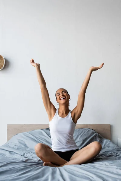 Smiling African American Woman Stretching While Sitting Bed Morning — Stock Photo, Image