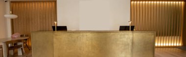 computer monitors at luxury reception desk in hotel, banner 