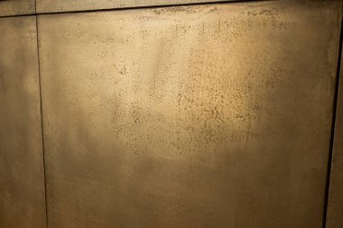 close up of golden wall at reception in luxury hotel 