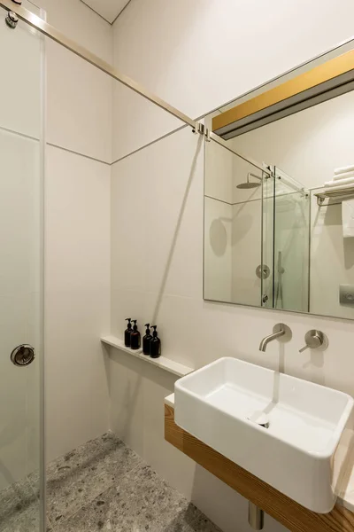 stock image interior of modern white bathroom with toiletry near white sink 