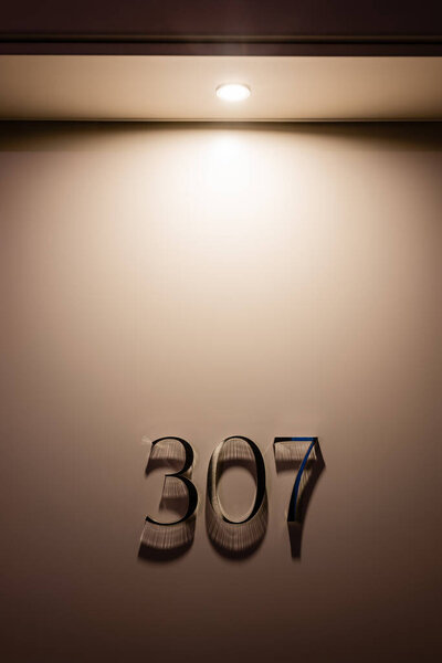 room door with three hundred and seven numbers in hotel 
