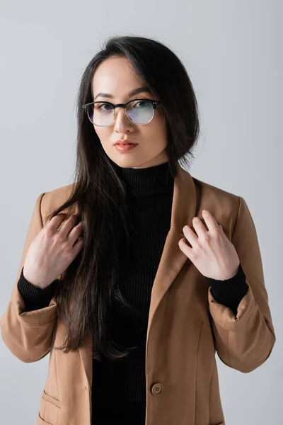 Young Asian Businesswoman Glasses Beige Blazer Looking Camera Isolated Grey — Foto Stock