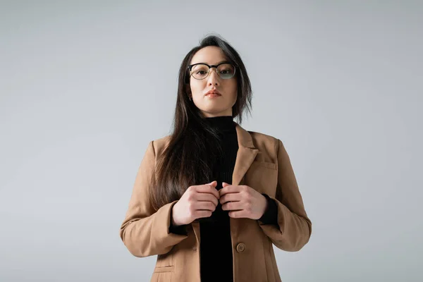 Young Asian Woman Beige Blazer Black Turtleneck Looking Camera Isolated — Foto Stock