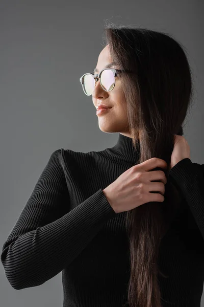 Smiling Asian Woman Black Turtleneck Glasses Looking Away While Touching — Foto Stock