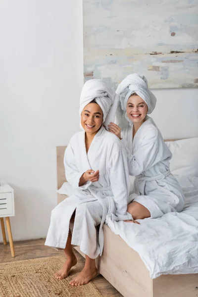Happy Interracial Women White Soft Robes Towels Looking Camera While — 스톡 사진