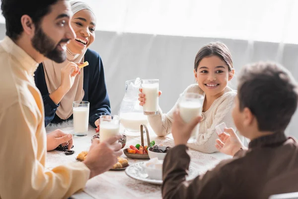 Positive Muslim Family Holding Glasses Milk Talking Food Suhur Home — Stockfoto