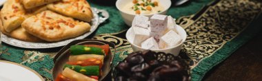 Delicious food on table during dinner at ramadan, banner 