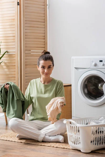 Positive Woman Holding Clothes Basket Washing Machine Home — Foto de Stock