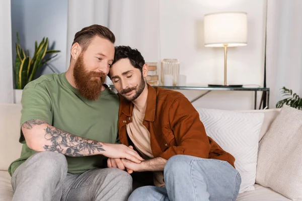 Gay Man Holding Hand Partner While Sitting Couch Home — Stock Fotó