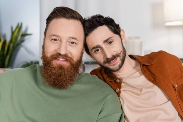 Portrait Smiling Same Sex Couple Looking Camera Home — Foto Stock