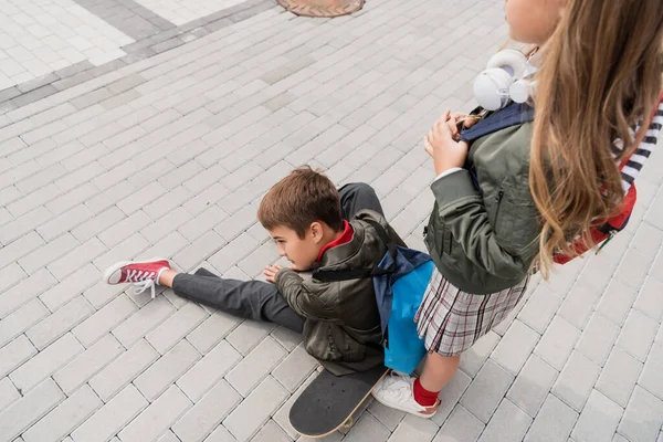 Overhead View Preteen Boy Stylish Bomber Jacket Sitting Penny Board — Stockfoto