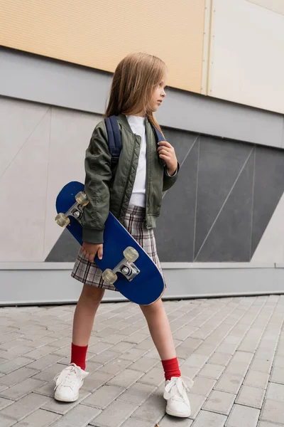 Full Length Stylish Preteen Girl Bomber Jacket Holding Penny Board — 图库照片