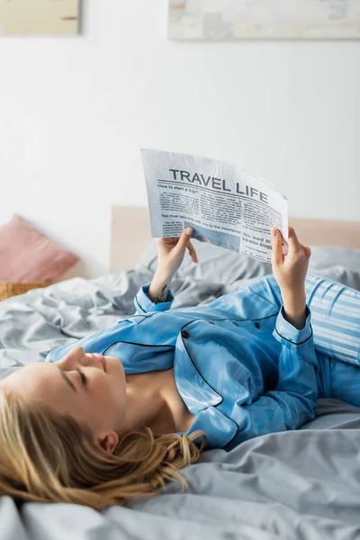 Tattooed Young Woman Smiling While Reading Travel Newspaper Bed — Stock Photo, Image