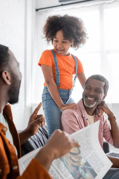 African American Kid Grandad Looking Blurred Father Newspaper Home — Stock Photo, Image