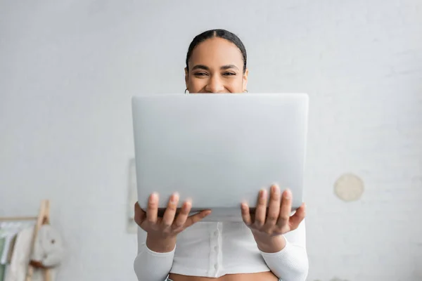 Happy African American Student Covering Half Face While Holding Laptop — Stock Photo, Image