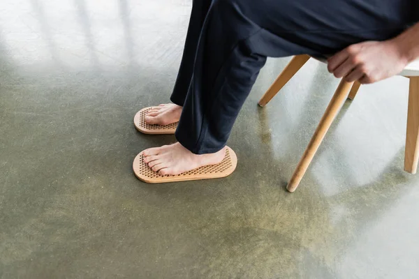 High Angle View Man Sitting Chair While Putting Bare Feet — Stock Photo, Image