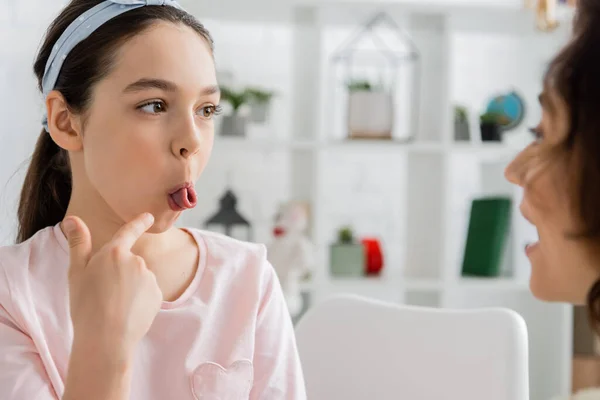 Preteen Kid Pointing Tongue Blurred Speech Therapist Consulting Room — Stock Photo, Image