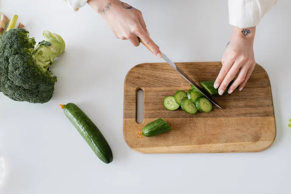 Top View Tattooed Woman Cutting Fresh Cucumber Kitchen — Stock Photo, Image