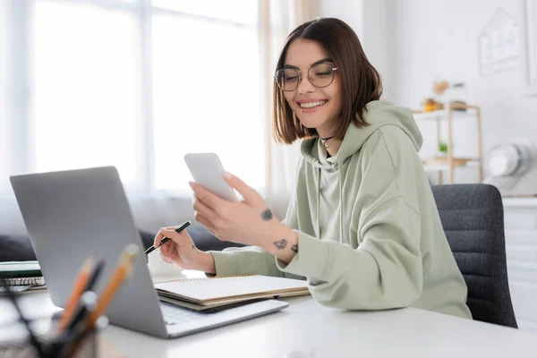 Cheerful Young Woman Using Smartphone Laptop Notebook Home — Stock Photo, Image