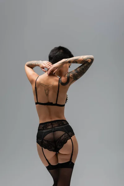 Back View Irresistible Woman Tattooed Body Sexy Buttocks Wearing Black — Stock Photo, Image