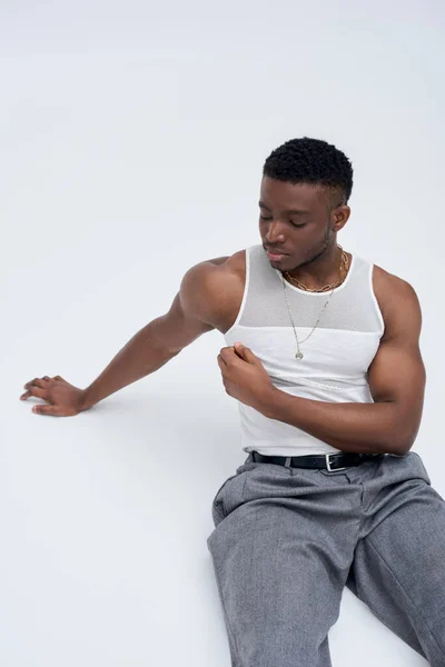 Strong African American Model Tank Top Pants Sitting Posing Confidently — Stock Photo, Image
