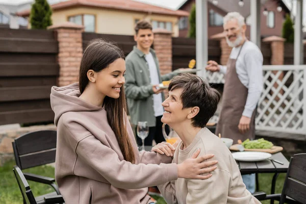 Cheerful Teenage Girl Talking Middle Aged Mother Family Grill Party — Stock Photo, Image