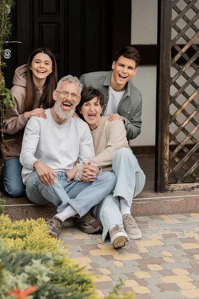 Excited Cheerful Middle Aged Parents Holding Hands Looking Camera Children — Stock Photo, Image