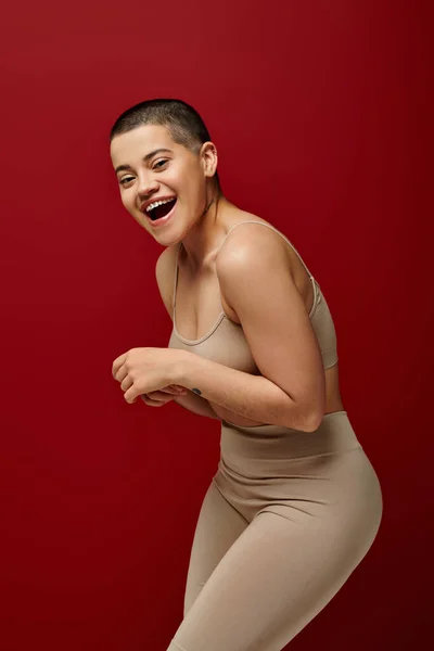 Self Esteem Happy Tattooed Woman Beige Underwear Posing Red Background — Stock Photo, Image