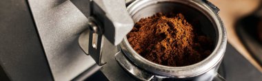 preparation of espresso, close up of grinded coffee in portafilter, coffee machine, banner clipart