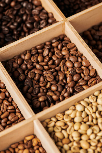 coffee beans in wooden box, different roast, caffeine and energy, espresso, coffee background 
