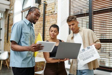 interracial coworkers holding gadgets, laptop, tablet, digital age, startup, men and woman, office clipart