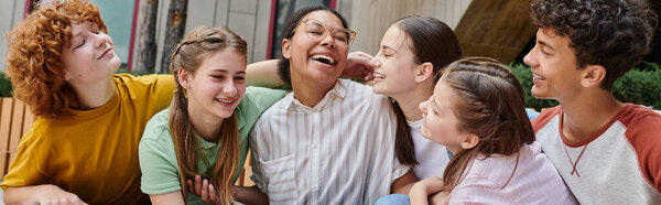 banner, happy african american woman hugging with teenage students, diversity, teacher, smile