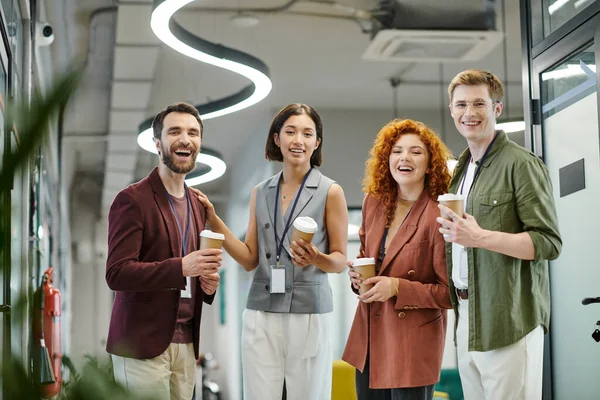 happy business people with coffee to go looking at camera in office, professional headshot
