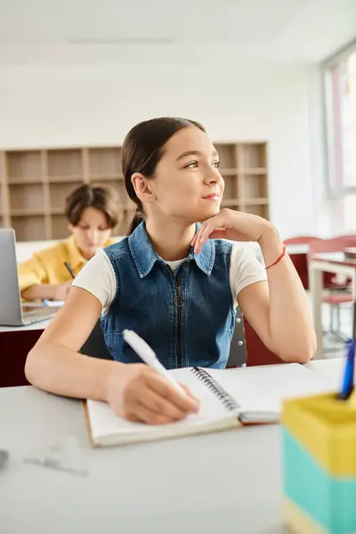 Young Girl Sits Desk Deeply Engrossed Her Notebook — Stock Photo, Image