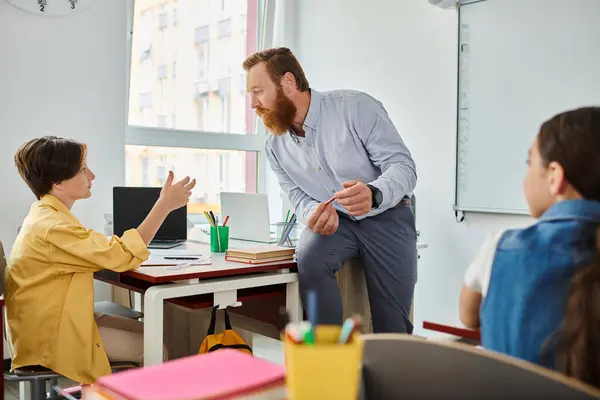 Man Stands Desk Passionately Teaching Young Child Vibrant Classroom Setting —  Fotos de Stock