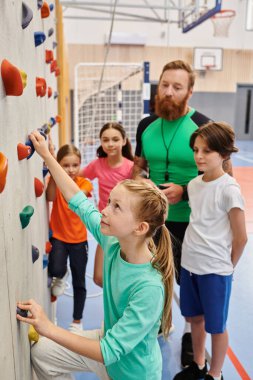 A man teacher instructs a diverse group of kids and adults as they stand around a climbing wall, preparing to embark on an adventurous climbing challenge. Bright, lively classroom setting adds to the excitement. clipart