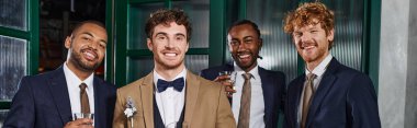 bachelor party banner, happy interracial best men and groom in suits holding glasses of whiskey clipart