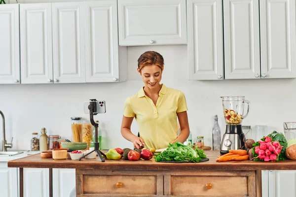 stock image culinary video blog, woman preparing vegetarian food from fresh plant origin ingredients in kitchen