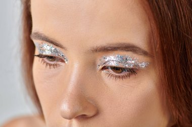 close up view of beautiful young woman with holiday makeup, shimmery eye shadow, Merry Christmas clipart