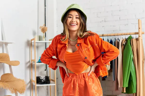 Trendy Happy Asian Dressmaker Posing Hands Hips Orange Clothes Panama — Stock Photo, Image
