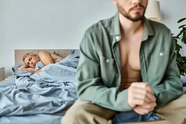 Disappointed Gay Man Lying Looking Boyfriend Sitting Dressing Bedroom Love — Stock Photo, Image