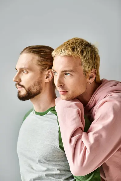 Romantic Dreamy Gay Couple Trendy Casual Attire Looking Away Grey — Stock Photo, Image