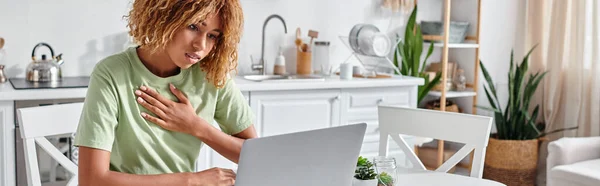 stock image curly african american woman telling please on sign language during video call on laptop, banner