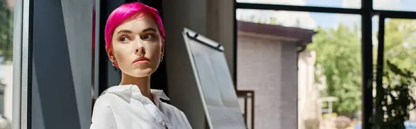 stock image pensive attractive businesswoman in casual office attire posing and looking away near window, banner