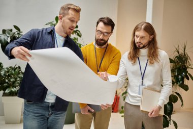 concentrated attractive coworkers in casual attires working together on their startup, business clipart