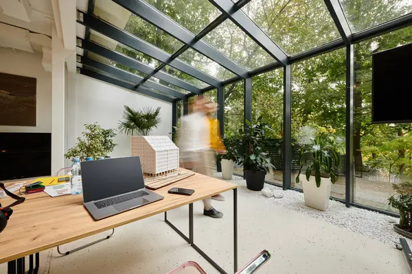 stock image long exposure picture of devoted coworkers moving around their office, startup, motion blur