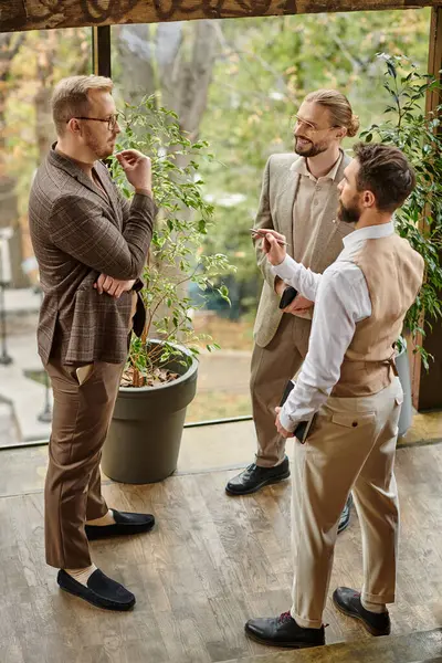 stock image happy good looking business leaders with glasses in elegant chic attires discussing their startup