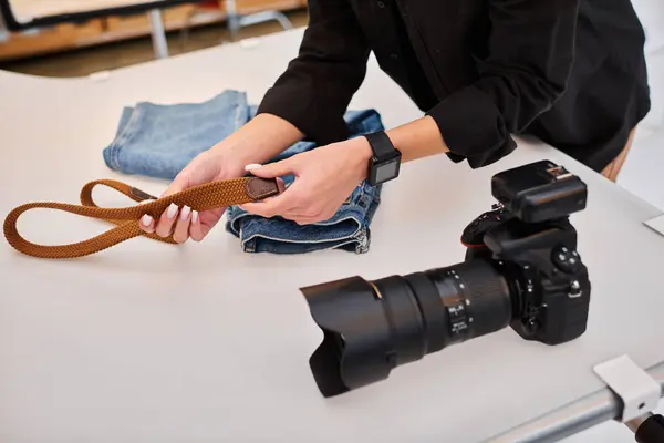 stock image cropped view of young talented female photographer preparing to make object photos on tabletop