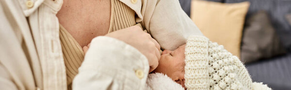 caring mother in comfy homewear breastfeeding her newborn baby boy, modern parenting, banner